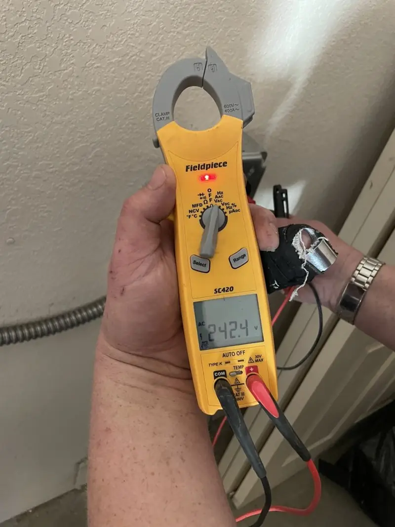 Voltage testing with clamp meter during Ceiling Fan Installation in Parma Heights